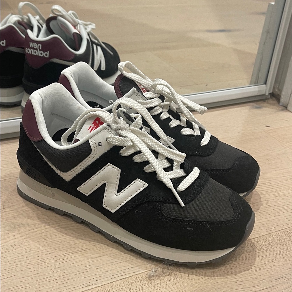 Black New Balance Sneakers with Purple Accent